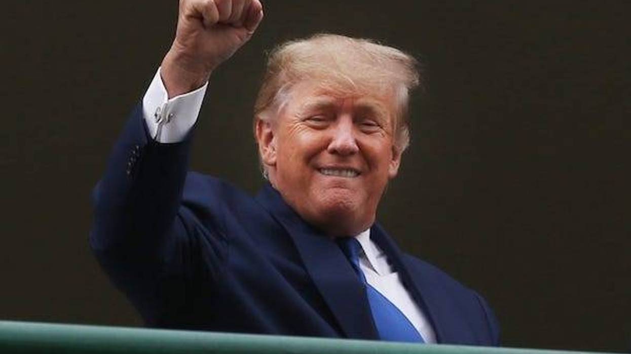 Former President Donald Trump reacts to the crowd before the beginning of the 148th Kentucky Derby