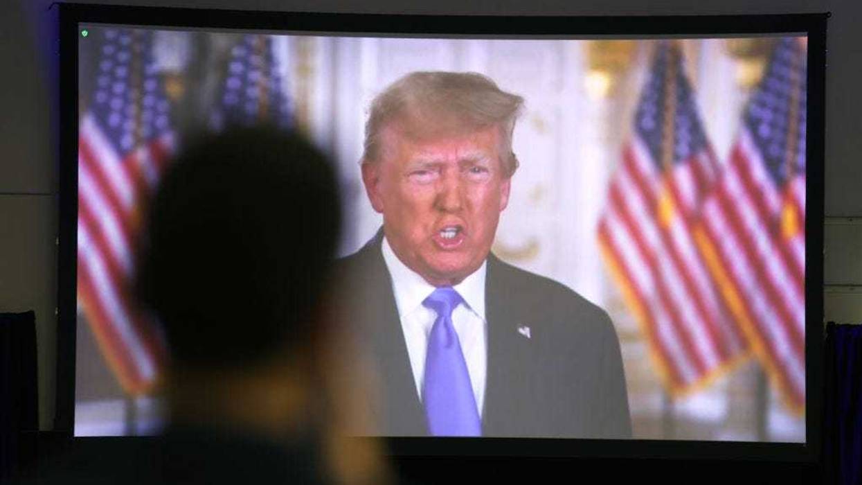 Former President Donald Trump speaks to guests via video link at the Iowa Faith & Freedom Coalition Spring Kick-Off on April 22, 2023 in Clive, Iowa. Iowa is scheduled to hold the first Republican presidential nominating contest of 2024, on Feb. 5. (Photo by Scott Olson/Getty Images)