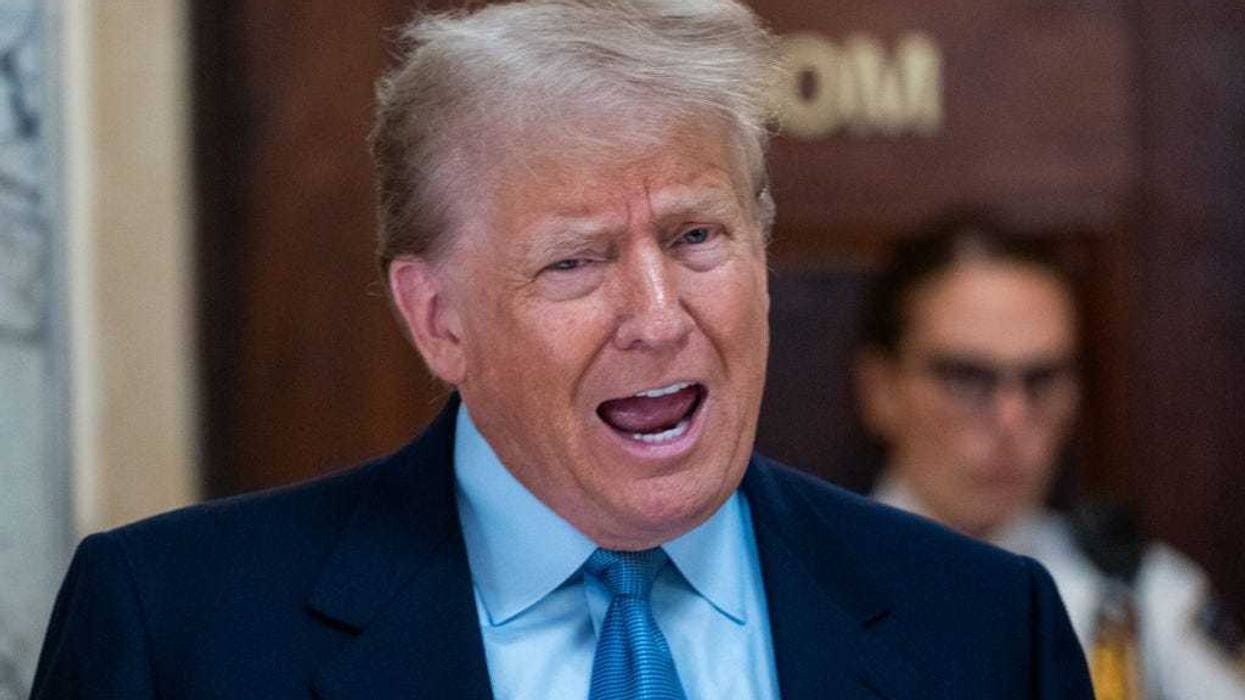 Former President Donald Trump speaks to the media during a break in his civil fraud trial at New York State Supreme Court on October 18, 2023 in New York City. The former president may be forced to sell off his properties after Justice Arthur Engoron canceled his business certificates and ruled that he committed fraud for years while building his real estate empire after being sued by Attorney General Letitia James, seeking $250 million in damages. The trial will determine how much he and his companies will be penalized for the fraud. (Photo by Spencer Platt/Getty Images)
