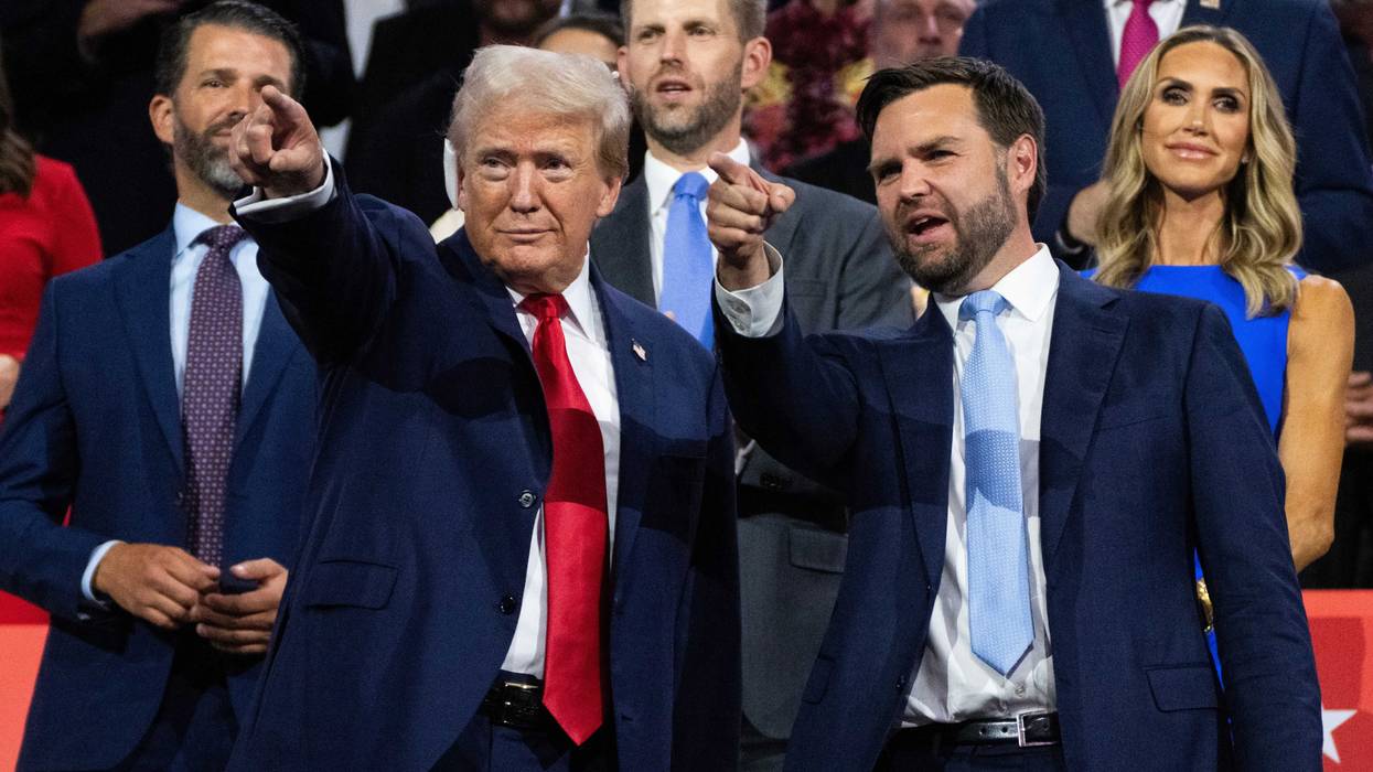 Former President Donald Trump, the Republican presidential nominee, is pictured with his running mate Sen. J.D. Vance, R-Ohio, right, in Fiserv Forum on the first day of Republican National Convention in Milwaukee, Wis., on Monday, July 15, 2024