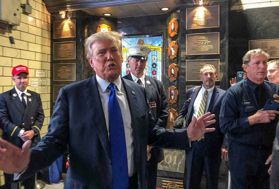 Former President Donald Trump visits the Engine Co. 8 firehouse where he praised first responders