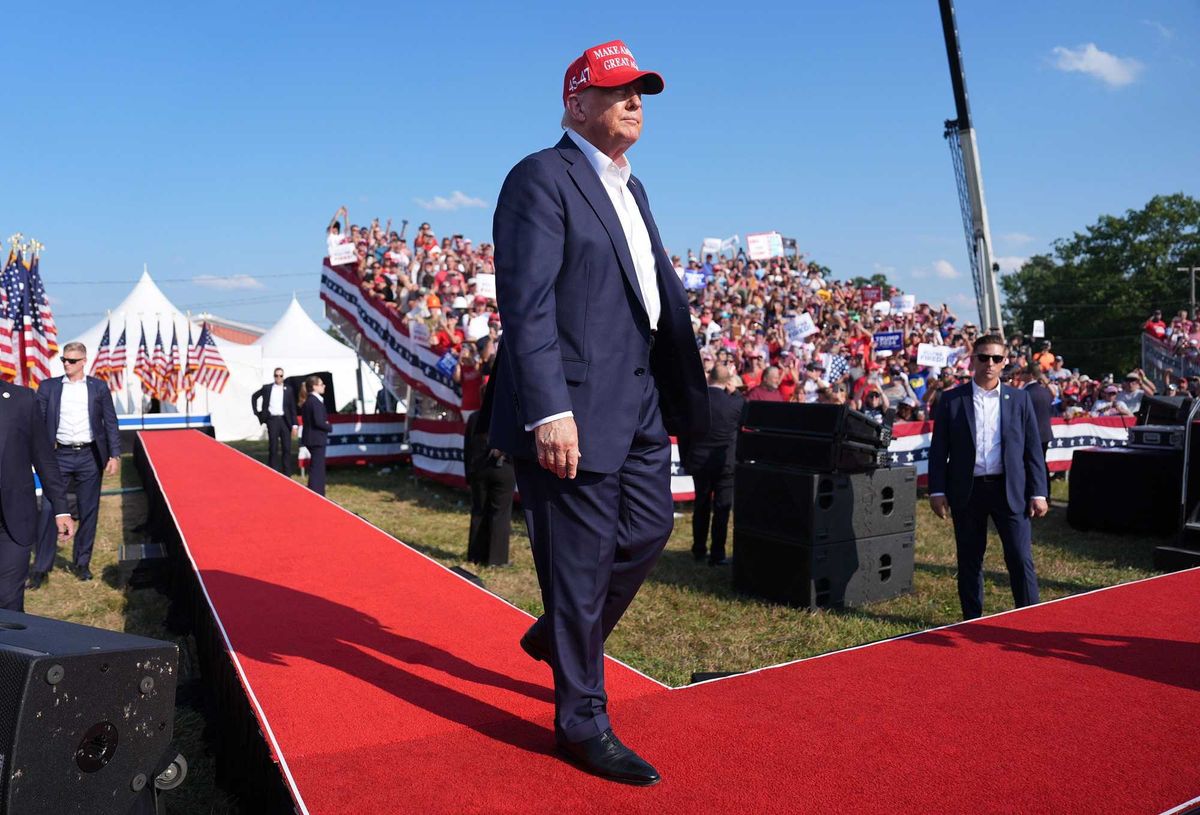 Former President Donald Trump walks onstage during a campaign rally in Butler, Pa. on July 13, 2024, moments before he was targeted by a would-be assassin