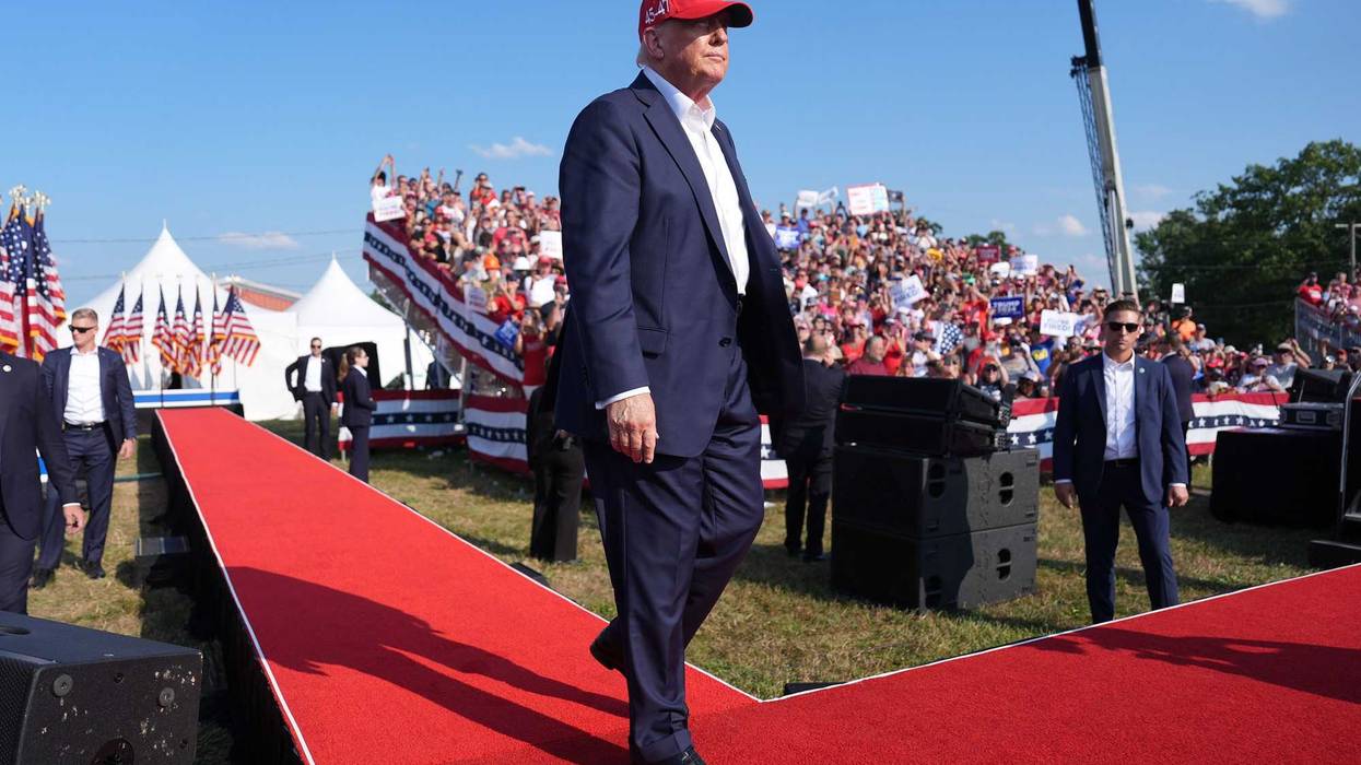 Former President Donald Trump walks onstage during a campaign rally in Butler, Pa. on July 13, 2024, moments before he was targeted by a would-be assassin