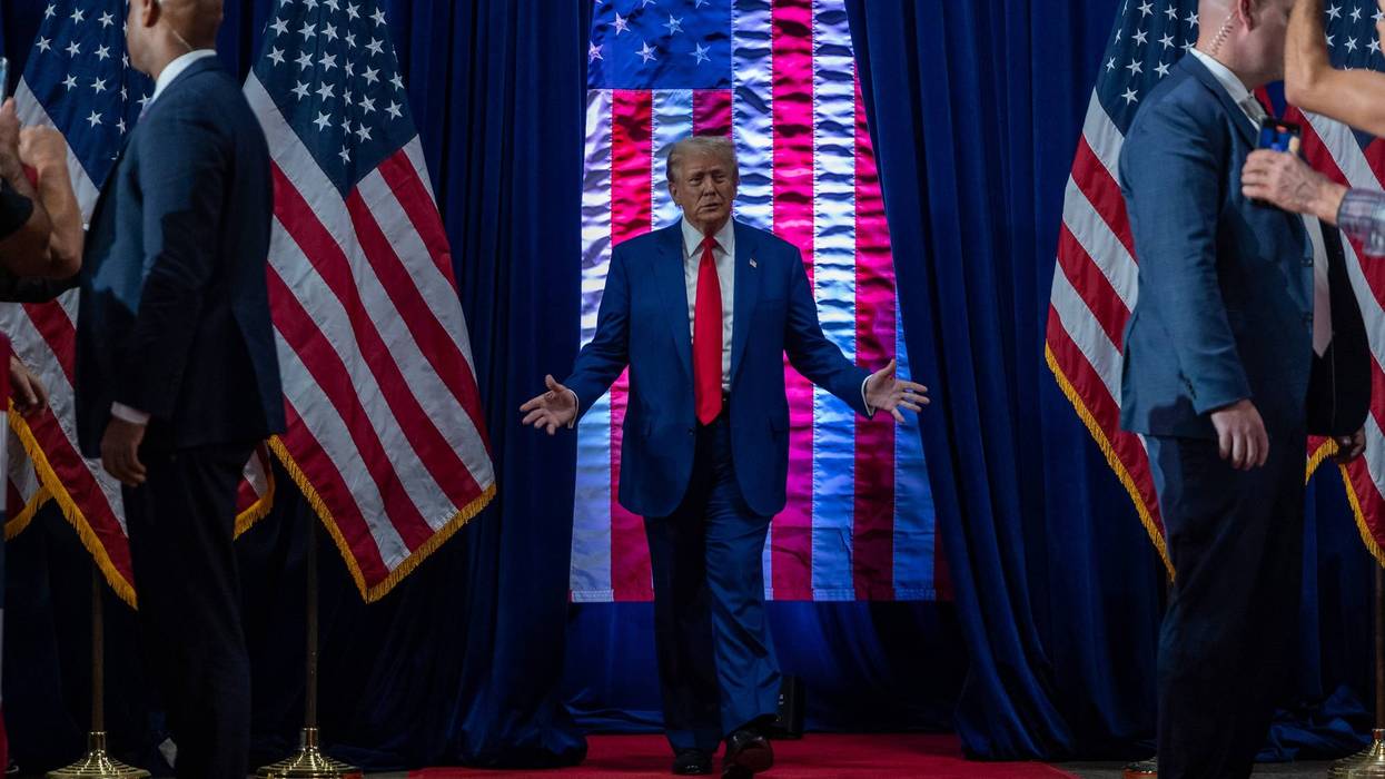 Former President Donald Trump walks onto the stage at his Town Hall in Oaks, Pennsylvania on Monday, October 14.