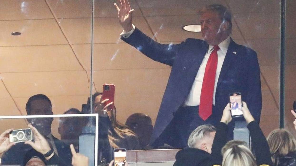 Former President Donald Trump waves to the crowd as the Pittsburgh Steelers play the New York Jets during the first quarter at Acrisure Stadium.