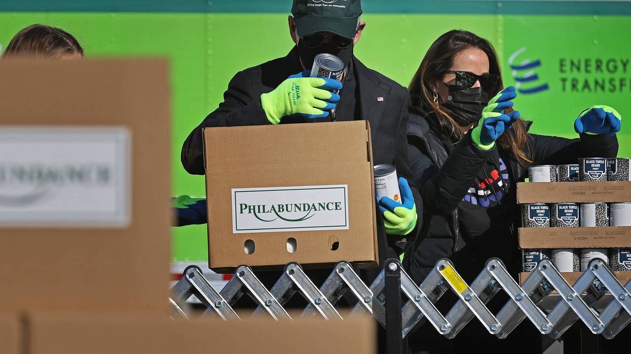 Former President Joe Biden and his daughter Ashley Biden volunteer to fill food donation boxes at the Philabundance food bank.