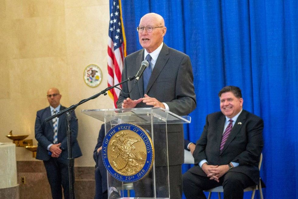 Former Republican Gov. Jim Edgar speaks at a ceremony to honor his name on the reading room at the Illinois State Library as Gov. JB Pritzker looks on.