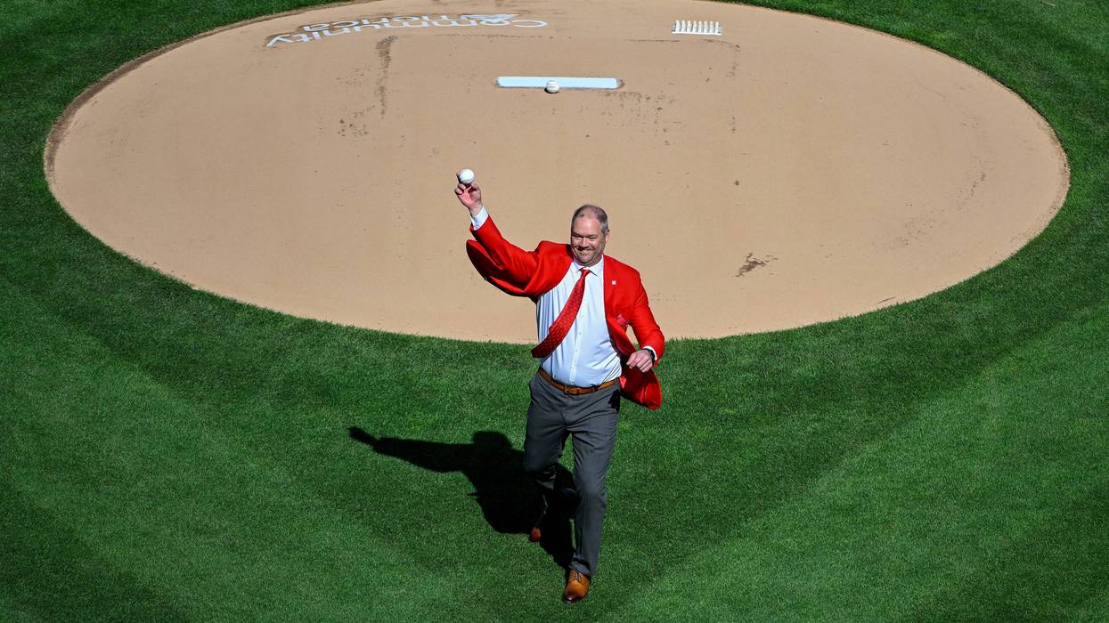 Former St. Louis Cardinal and hall of fame third baseman Scott Rolen throws out a first pitch before an opening day game.