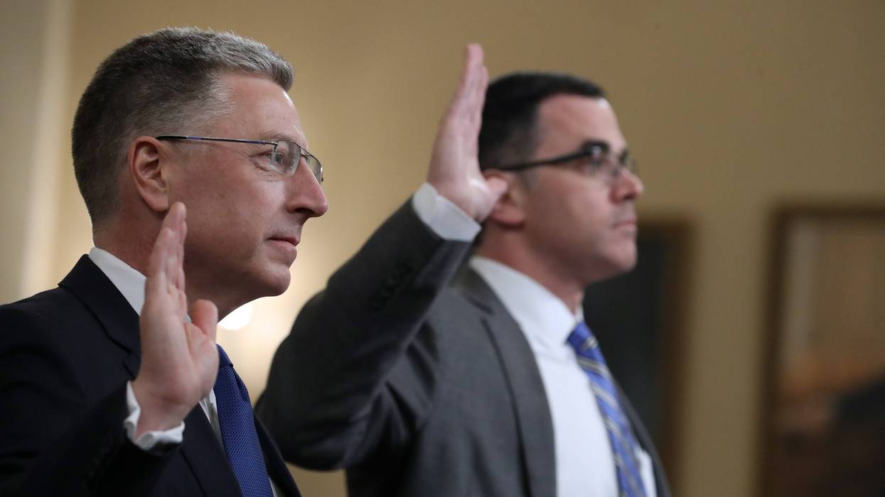 Former State Department special envoy to Ukraine Kurt Volker (L) and former National Security Council Senior Director for European and Russian Affairs Tim Morrison are sworn in before testifying to the House Intelligence Committee on Nov. 19, 2019.