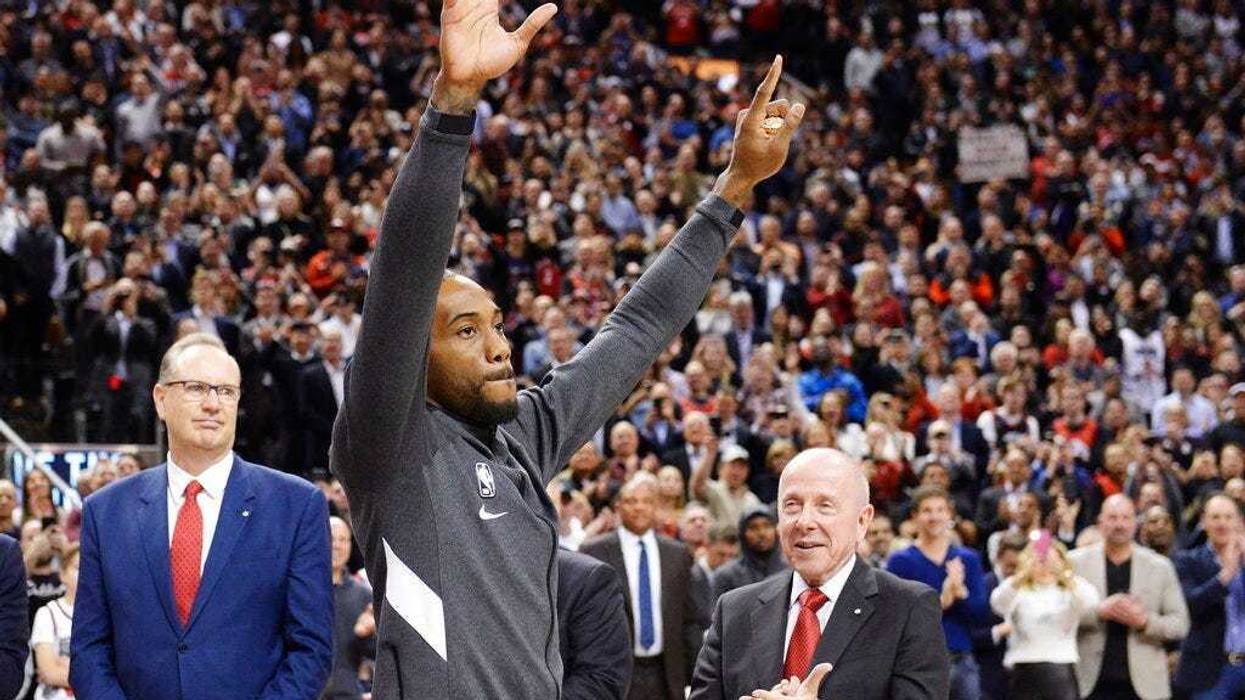 Former Toronto Raptors and now Los Angeles Clippers forward Kawhi Leonard salutes the crowd as he receives his 2019 NBA championship ring prior to an NBA basketball game, Wednesday, Dec. 11, 2019, in Toronto.