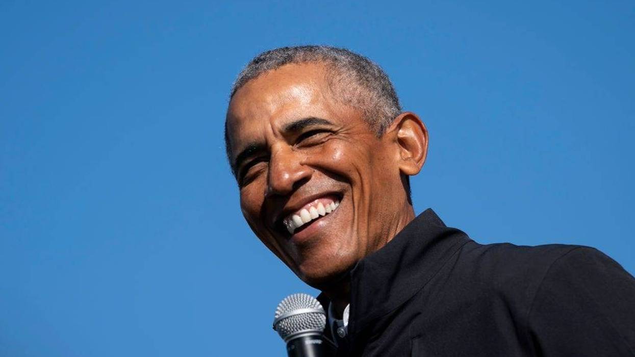 Former U.S. President Barack Obama speaks during a drive-in campaign rally for Democratic presidential nominee Joe Biden at Northwestern High School on October 31, 2020 in Flint, Michigan.