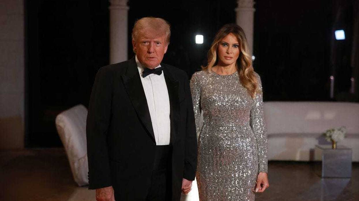 Former U.S. President Donald Trump and former first lady Melania Trump arrive for a New Years event at his Mar-a-Lago home on December 31, 2022 in Palm Beach, Florida.
