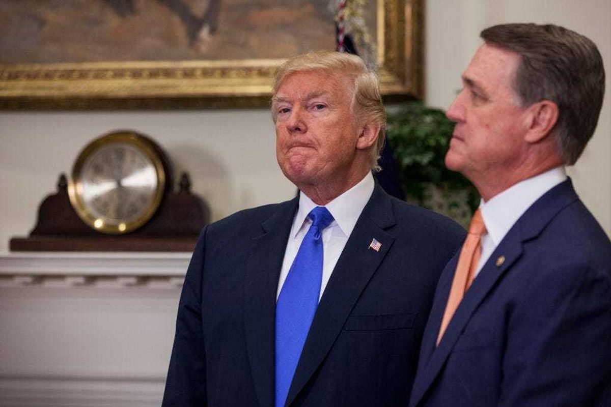 Former U.S. President Donald Trump and former Georgia senator David Perdue in the Roosevelt Room at the White House on August 2, 2017 in Washington, DC. (Photo by Zach Gibson - Pool/Getty Images)