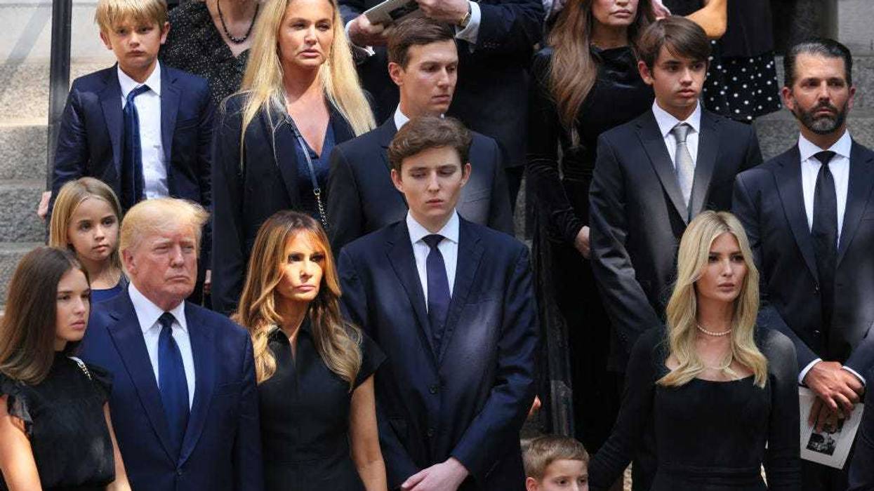 Former U.S. President Donald Trump and his wife Melania Trump along with their son Barron Trump and Ivanka Trump and their children watch as the casket of Ivana Trump is put in a hearse outside of St. Vincent Ferrer Roman Catholic Church during her funeral on July 20, 2022 in New York City. Trump, the first wife of former U.S. President Donald Trump, died at the age of 73 after a fall down the stairs of her Manhattan home. (Photo by Michael M. Santiago/Getty Images)