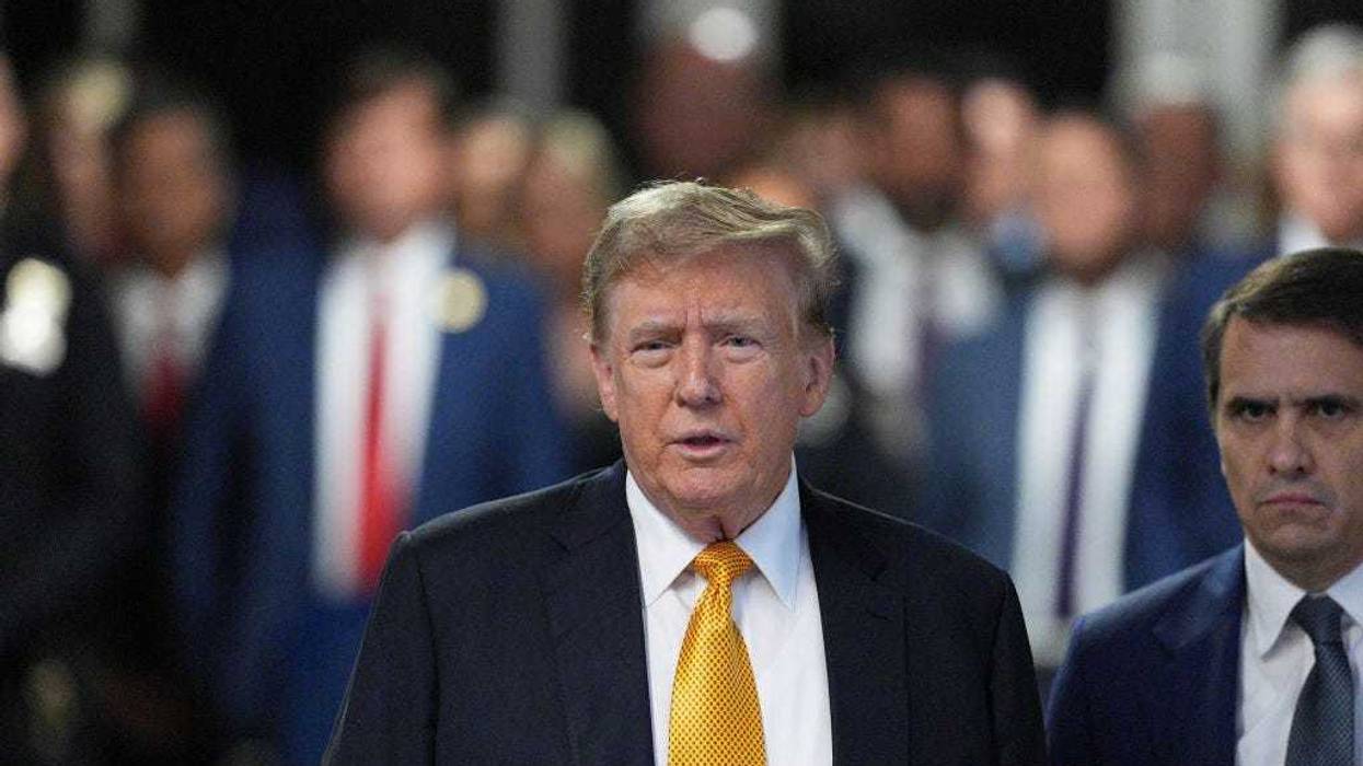 Former U.S. President Donald Trump arrives for his trial for allegedly covering up hush money payments at Manhattan Criminal Court on May 21, 2024 in New York City.