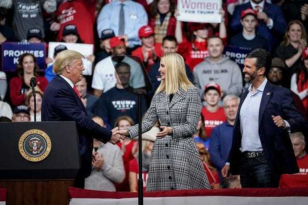 Former U.S. President Donald Trump greets his daughter Ivanka Trump and son Donald Trump Jr.