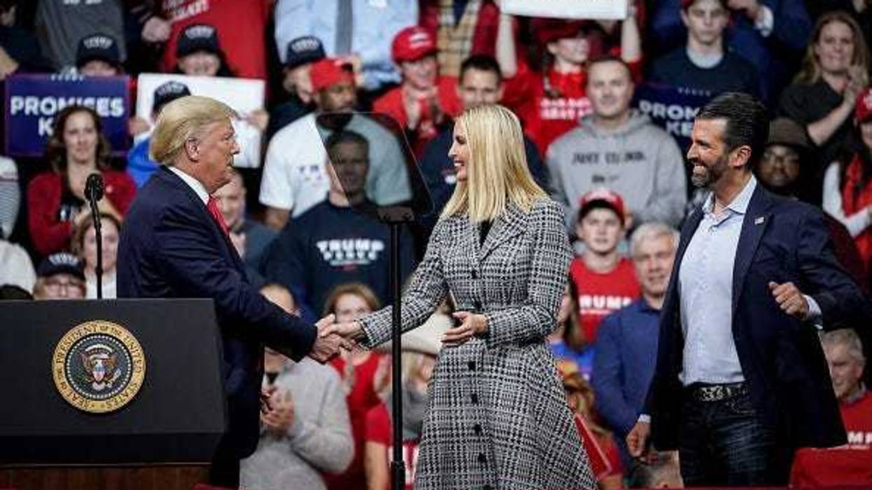 Former U.S. President Donald Trump greets his daughter Ivanka Trump and son Donald Trump Jr.