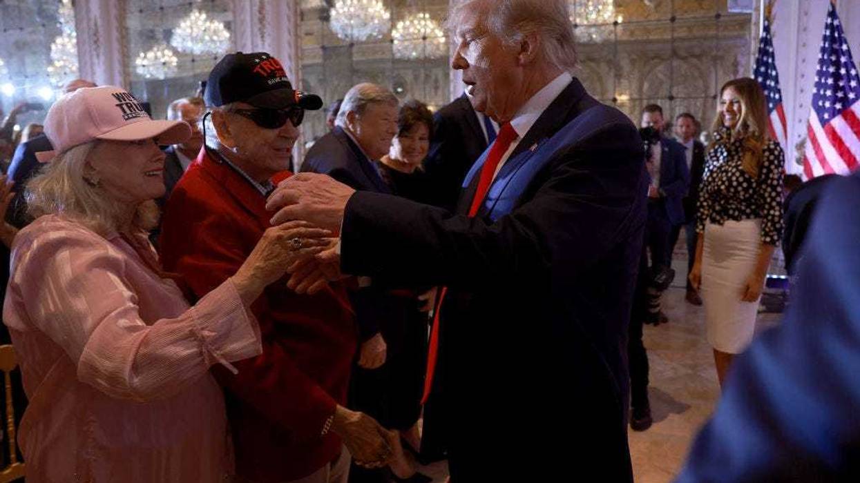 Former U.S. President Donald Trump greets supporters during an event at his Mar-a-Lago home on November 15, 2022 in Palm Beach, Florida. T