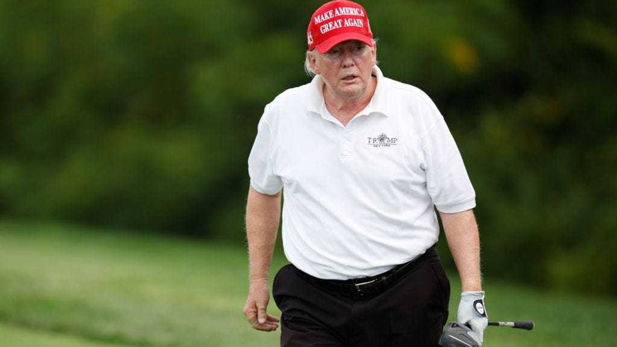Former U.S. President Donald Trump reacts after his shot from the second tee during the pro-am prior to the LIV Golf Invitational - Bedminster at Trump National Golf Club Bedminster on July 28, 2022 in Bedminster, New Jersey.