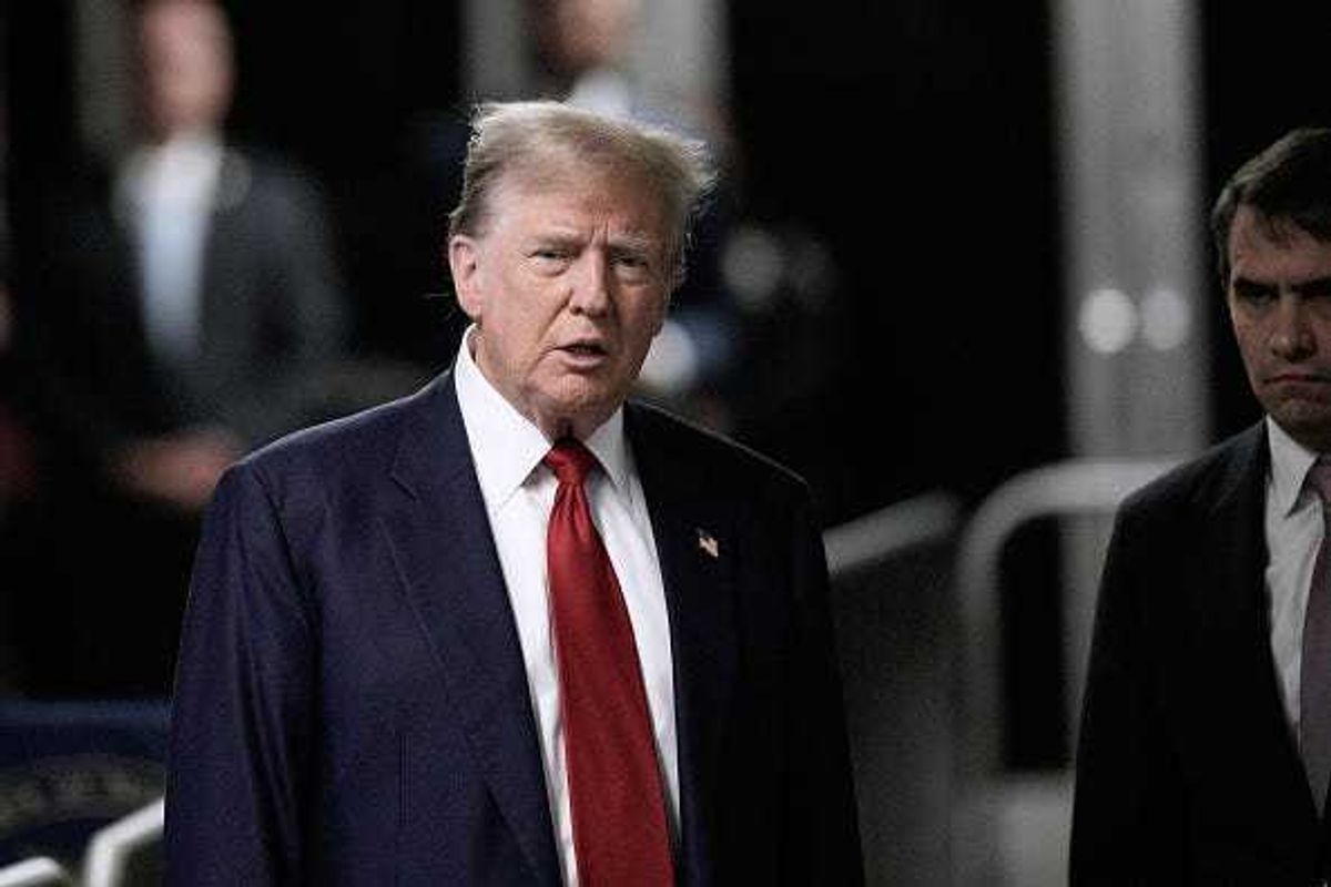 Former U.S. President Donald Trump speaks to the media as he arrives to court with attorney Todd Blanche (R) during his trial for allegedly covering up hush money payments at Manhattan Criminal Court on April 30, 2024 in New York City.