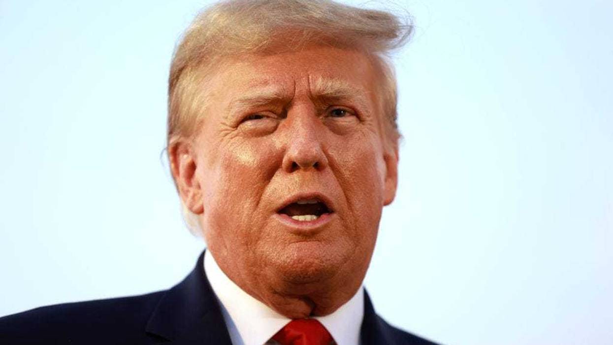 Former U.S. President Donald Trump speaks to the media at Atlanta Hartsfield-Jackson International Airport after being booked at the Fulton County jail on August 24, 2023 in Atlanta, Georgia.