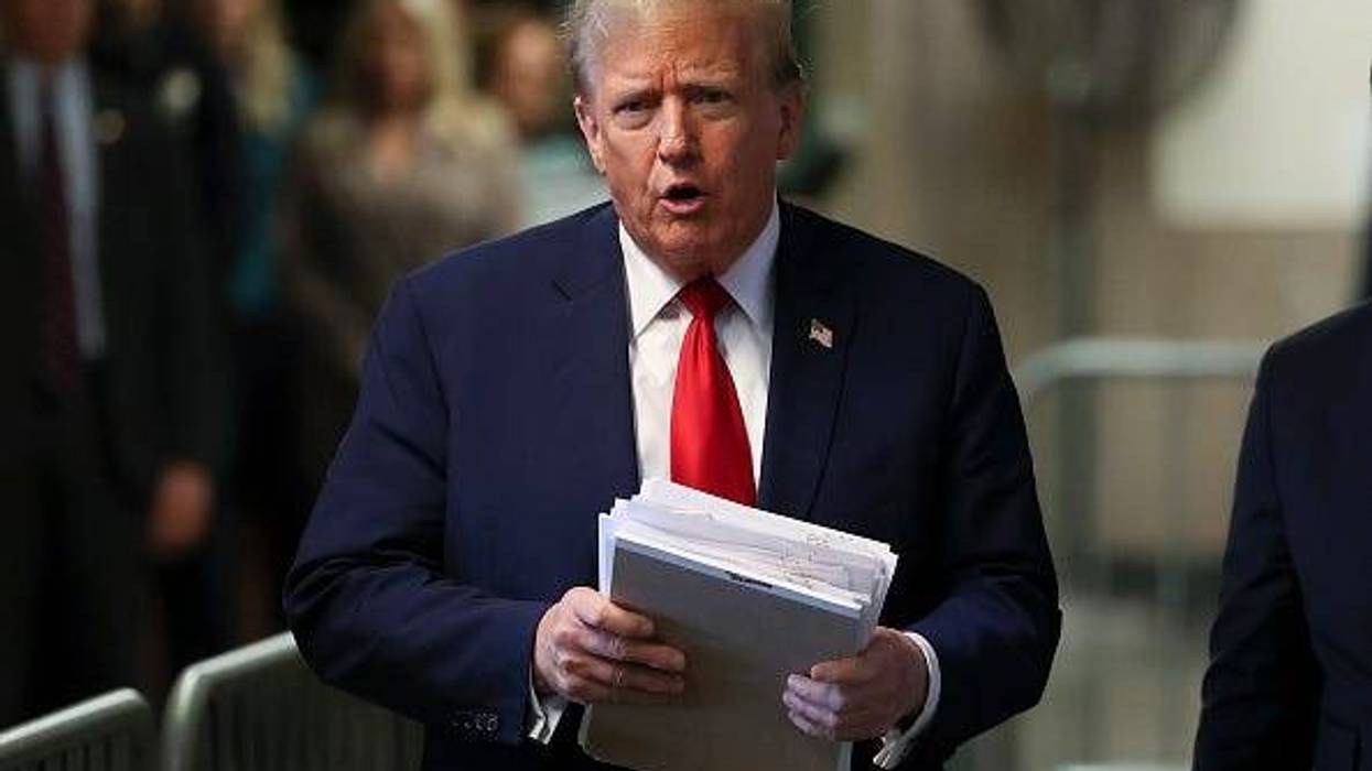 Former U.S. President Donald Trump speaks to the media while departing Manhattan Criminal Court