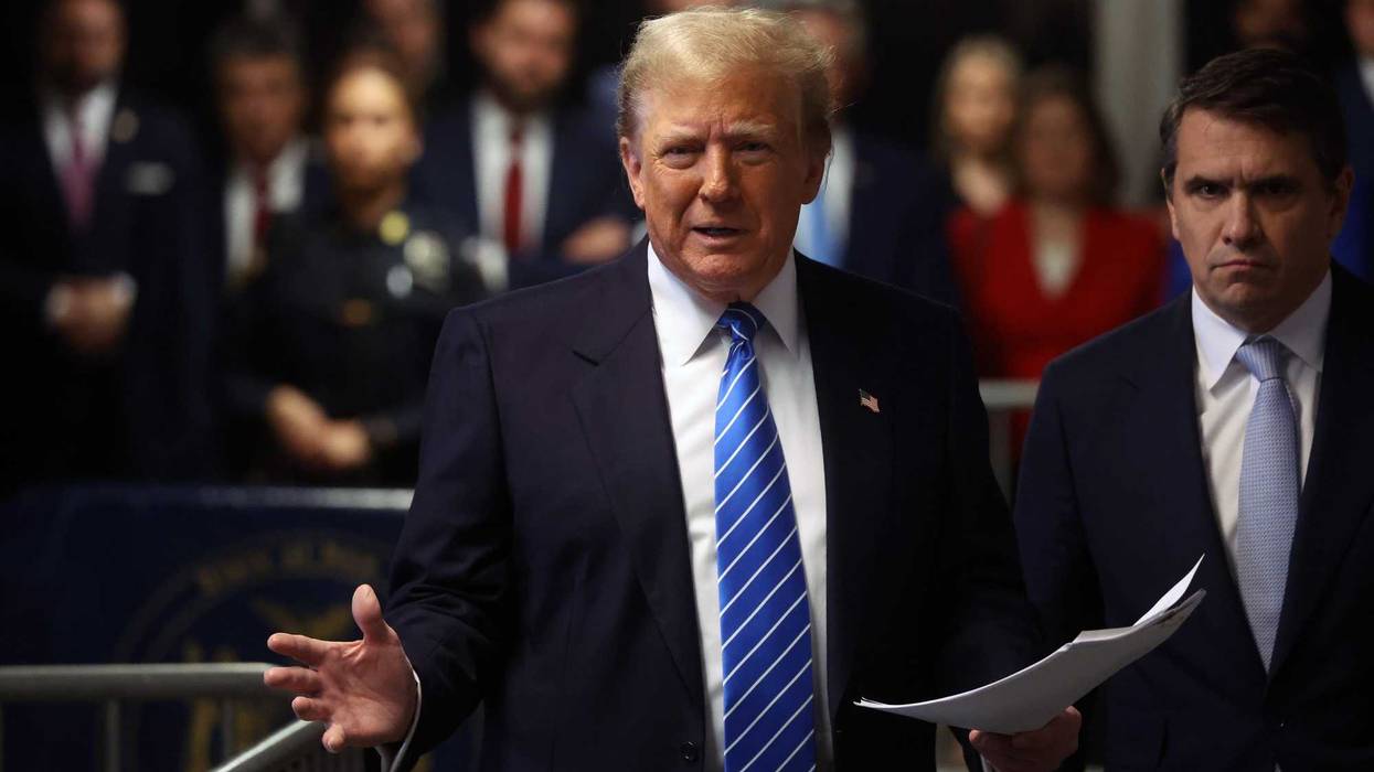 Former U.S. President Donald Trump speaks to the media with attorney Todd Blanche as he attends his trial for allegedly covering up hush money payments at Manhattan Criminal Court on May 13, 2024 in New York City.