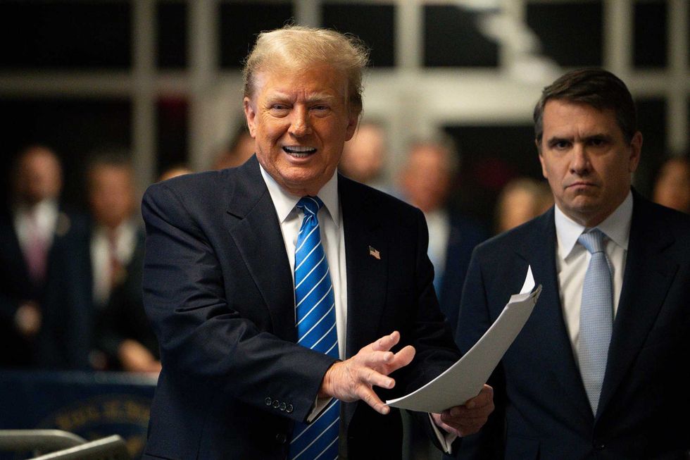 Former U.S. President Donald Trump speaks to the media with attorney Todd Blanche at his trial for allegedly covering up hush money payments at Manhattan Criminal Court on May 13, 2024 in New York City.