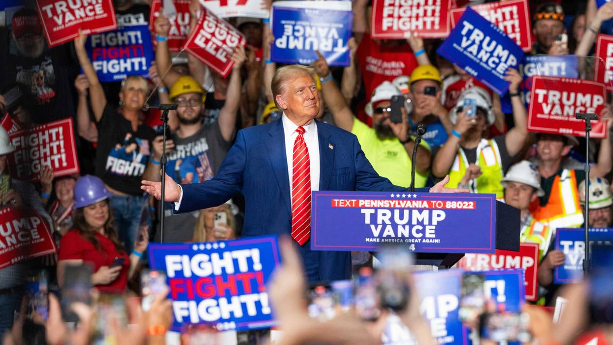Former US President and Republican presidential candidate Donald Trump reacts as he arrives to speak at a rally at 1st Summit Arena at the Cambria County War Memorial in Johnstown, Pennsylvania, on August 30, 2024