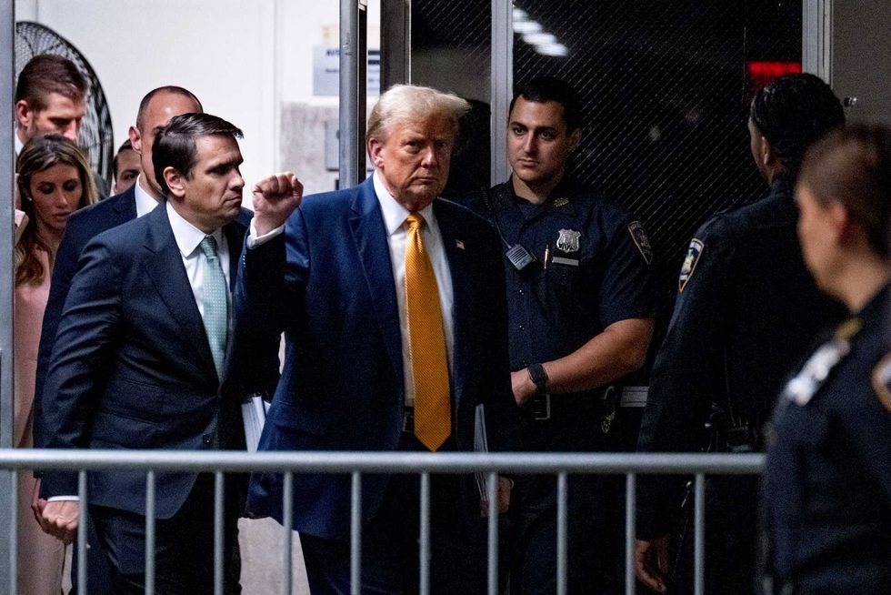 Former US President Donald Trump arrives for afternoon proceedings for his trial for allegedly covering up hush money payments linked to an extramarital affair with Stormy Daniels, at Manhattan Criminal Court on May 14, 2024 in New York City.