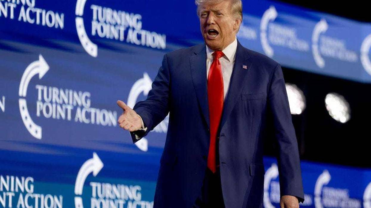 Former US President Donald Trump arrives on stage to speak at the Turning Point Action conference as he continues his 2024 presidential campaign on July 15, 2023 in West Palm Beach, Florida.