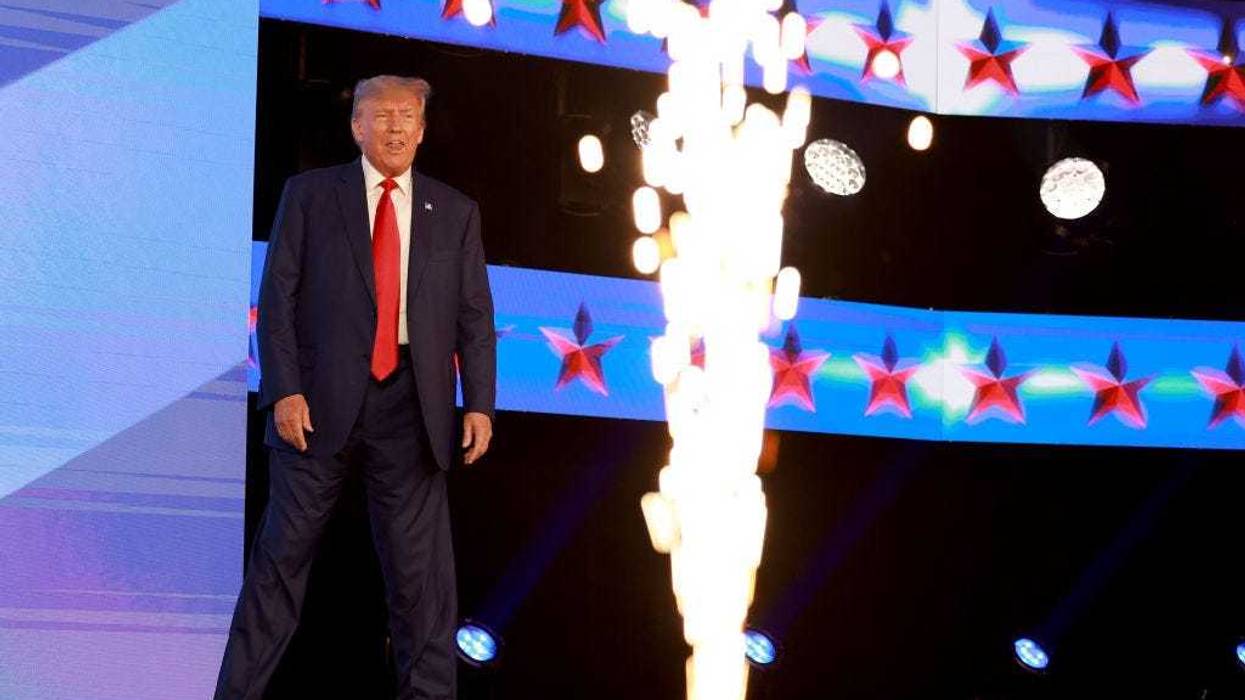 Former US President Donald Trump arrives on stage to speak at the Turning Point Action conference as he continues his 2024 presidential campaign on July 15, 2023 in West Palm Beach, Florida.
