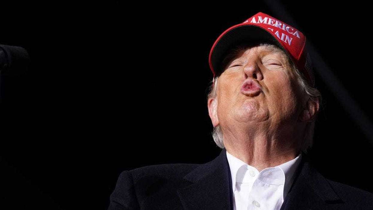 Former US President Donald Trump blows a kiss to the crowd during a rally at the Florence Regional Airport on March 12, 2022 in Florence, South Carolina. Todays visit by Trump is his first rally in South Carolina since his election loss in 2020. (Photo by Sean Rayford/Getty Images)