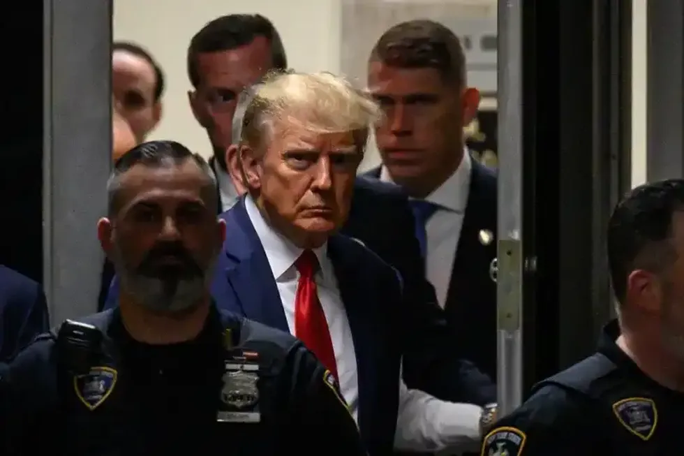 Former US President Donald Trump makes his way inside the Manhattan Criminal Courthouse in New York on April 4, 2023.