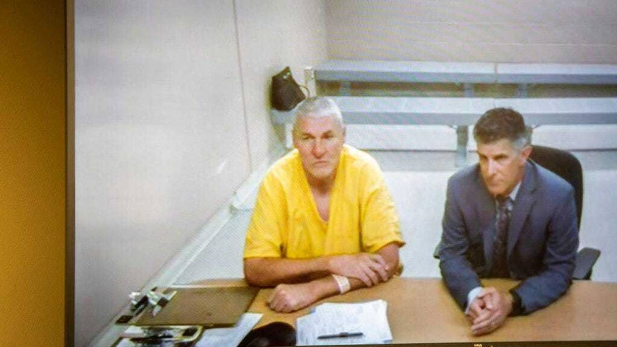 Former Washington State quarterback and Superbowl MVP Mark Rypien appears alongside defense attorney Chris Bugbee