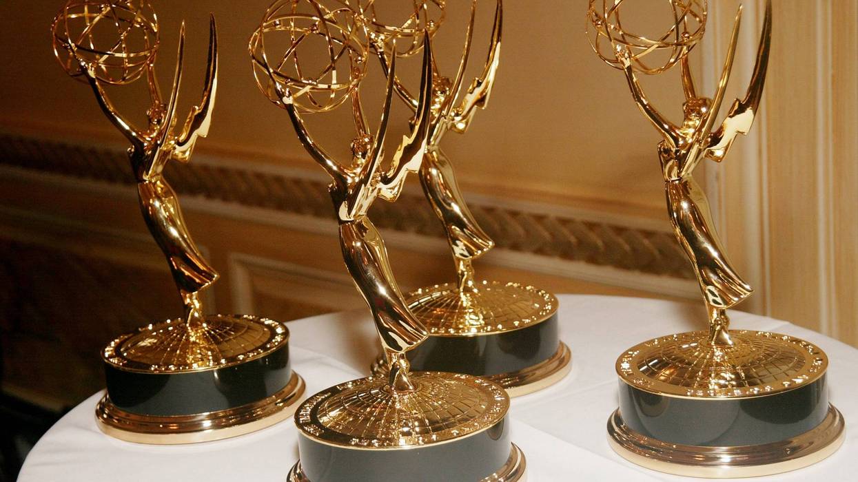 four emmy awards on a table