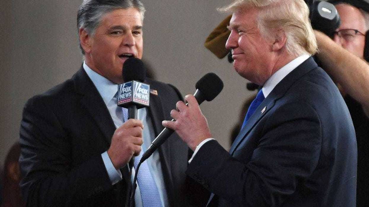 Fox News Channel and radio talk show host Sean Hannity (L) interviews U.S. President Donald Trump before a campaign rally at the Las Vegas Convention Center on September 20, 2018 in Las Vegas, Nevada.