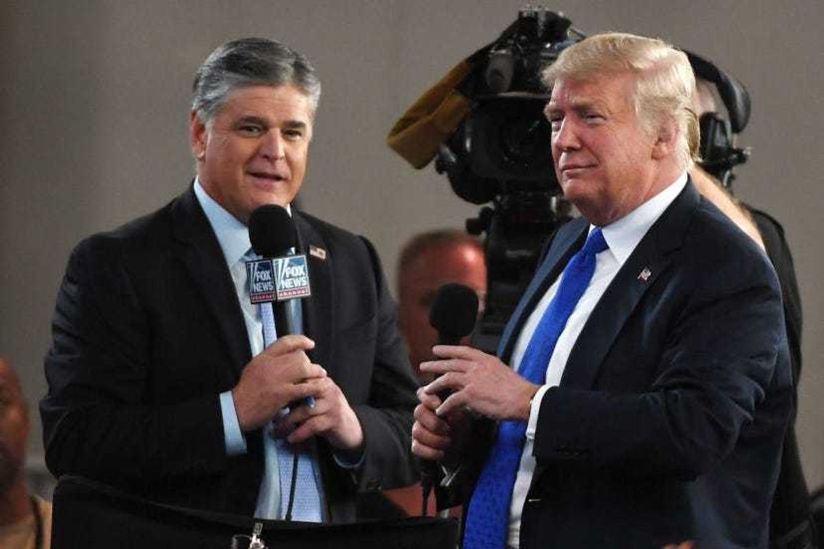 Fox News Channel and radio talk show host Sean Hannity (L) interviews U.S. President Donald Trump.