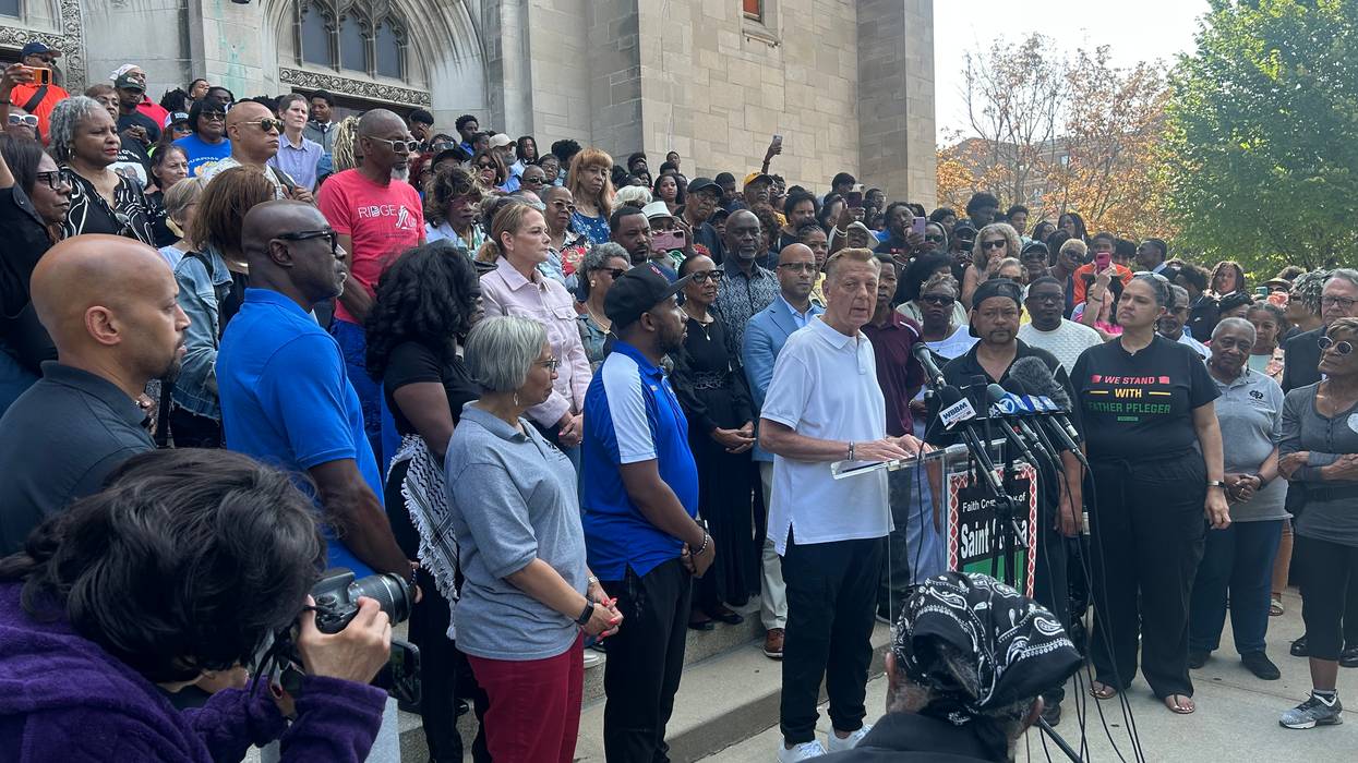 Fr. Michael Pfleger with supporters after sexual abuse investigation ends