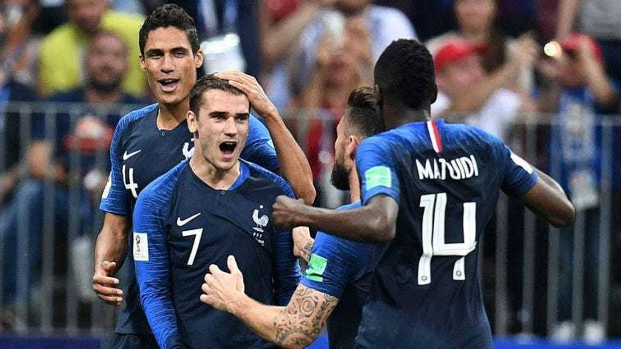 France's Antoine Griezmann (7) celebrates with teammates after scoring a goal on a penalty kick against Croatia in the final of the FIFA World Cup 2018 on July 15, 2018, at Luzhniki Stadium in Moscow.