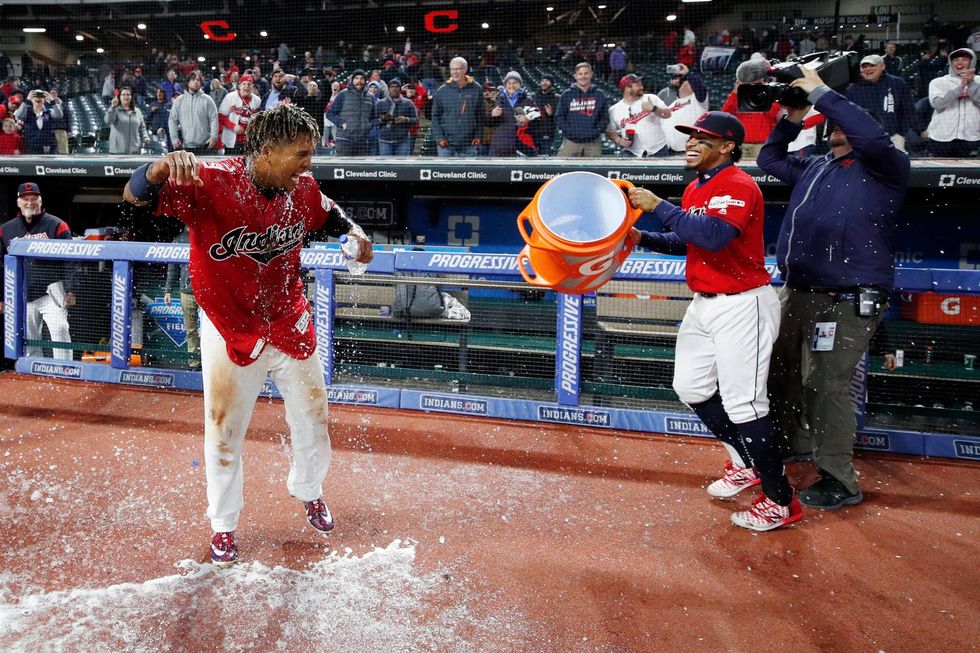 Francisco Lindor dumps a bucket of Gatorade on teammate Jose Ramirez after a walk-off hit