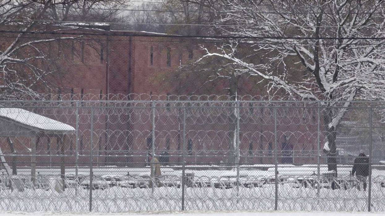 Fresh snow covers a courtyard surrounded by inmate barracks at FCI Fort Dix in Fort Dix, New Jersey