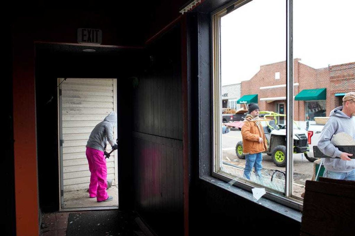 Friends and family help clean up a bar that was damaged in the aftermath of tornados that came through the region on March 15, 2024 in Indian Lake, Ohio. The storms caused casualties, resulting in deaths, and left many people without homes. (Photo by Andrew Spear/Getty Images)