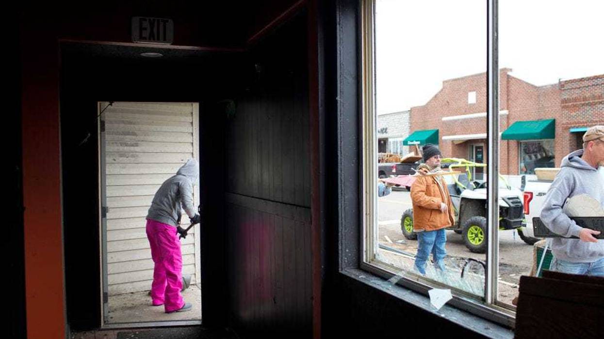 Friends and family help clean up a bar that was damaged in the aftermath of tornados that came through the region on March 15, 2024 in Indian Lake, Ohio. The storms caused casualties, resulting in deaths, and left many people without homes. (Photo by Andrew Spear/Getty Images)