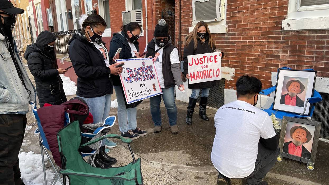 Friends and family members of 83-year-old Mauricio Gesmundo hold a vigil in front of his Hunting Park home. Gesmundo was brutally beaten on New Year's Eve and later died from his injuries.