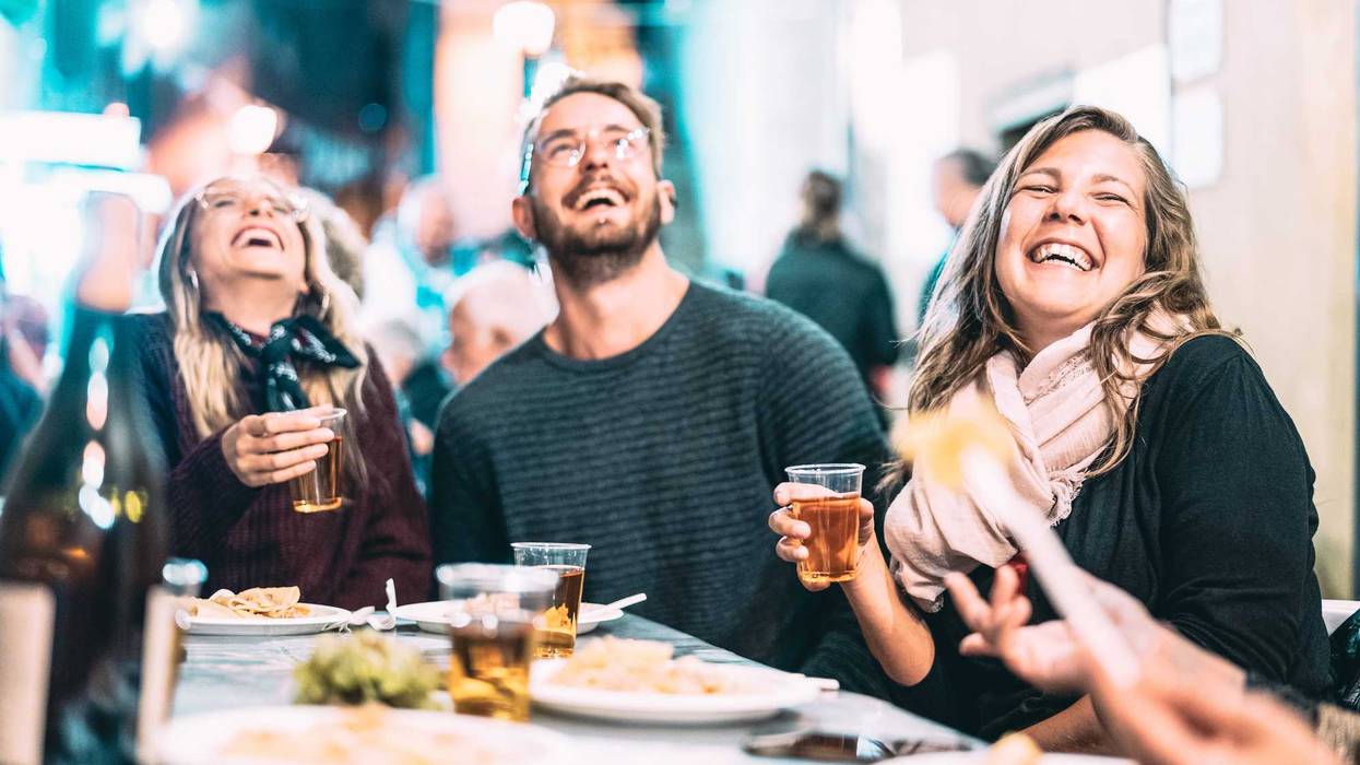 Friends eating and drinking together