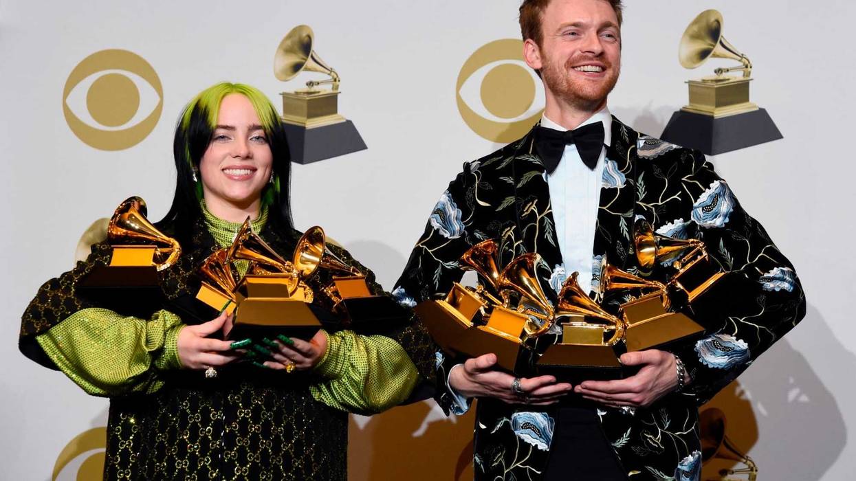 From left: Billie Eilish and Finneas O'Connell pose in the press room with the awards for best album, best engineered album, best pop vocal album, best song, best record, best new artist and best producer, non-classical, at the 62nd annual Grammy Awards.
