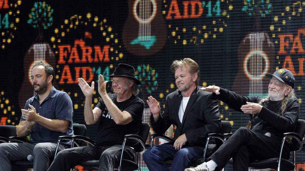 From left, Dave Matthews, Neil Young, John Mellencamp, and Willie Nelson applaud a farmer during a news conference held before the Farm Aid '14 concert. All are scheduled to appear in Minneapolis for Farm Aid but now that show is in doubt due to a strike.