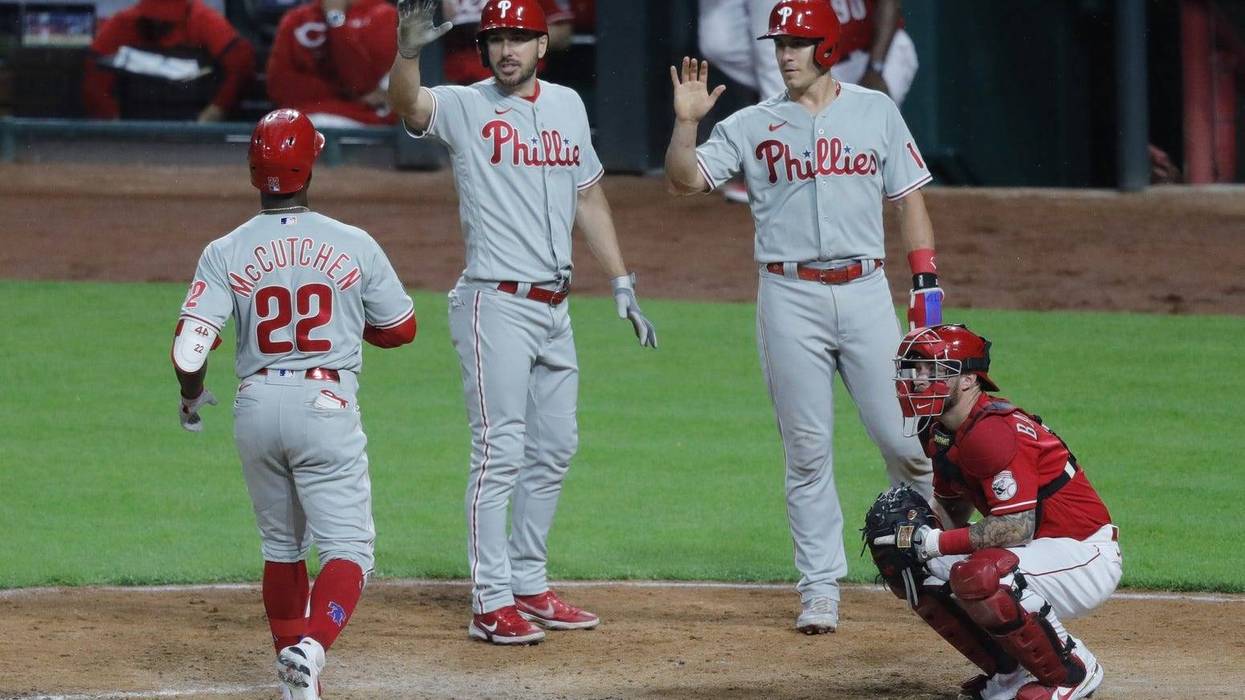 From left: Philadelphia Phillies left fielder Andrew McCutchen, outfielder Matt Joyce, and catcher J.T. Realmuto