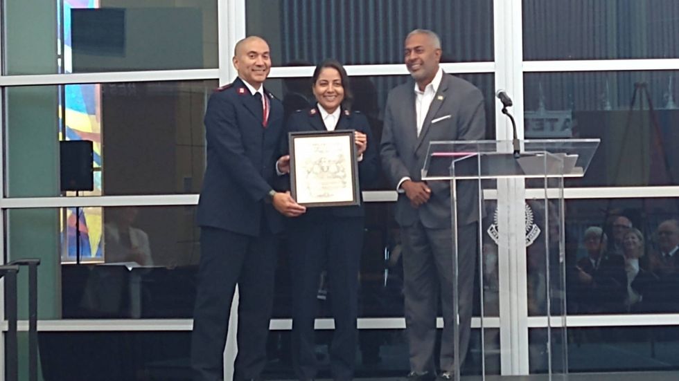 From left: Salvation Army Majs. Richard and Lolita Sanchez, Camden Mayor Vic Carstarphen